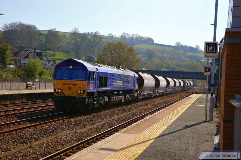 66047 "Maritime Intermodal Two" in blue livery heads east on: 6C53 12:14 Parkandillack to Riverside. Thursday 16th April 2020